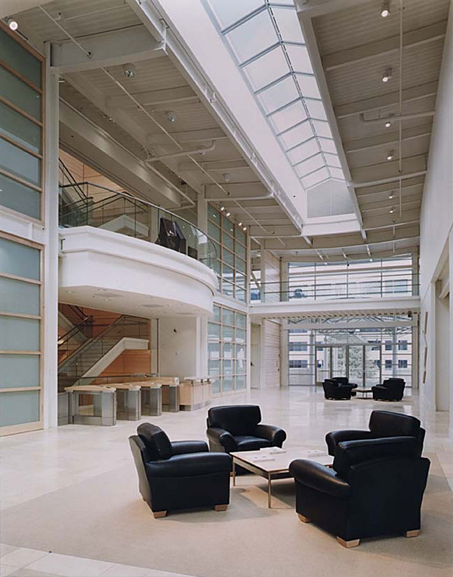 Modern Green Virginia Architect Designed 901 Cherry Gap Corporate Campus in San Bruno, CA - image showing Daylit Entrance with Skylight, Balcony, Club Chairs and Terrazzo Floor.