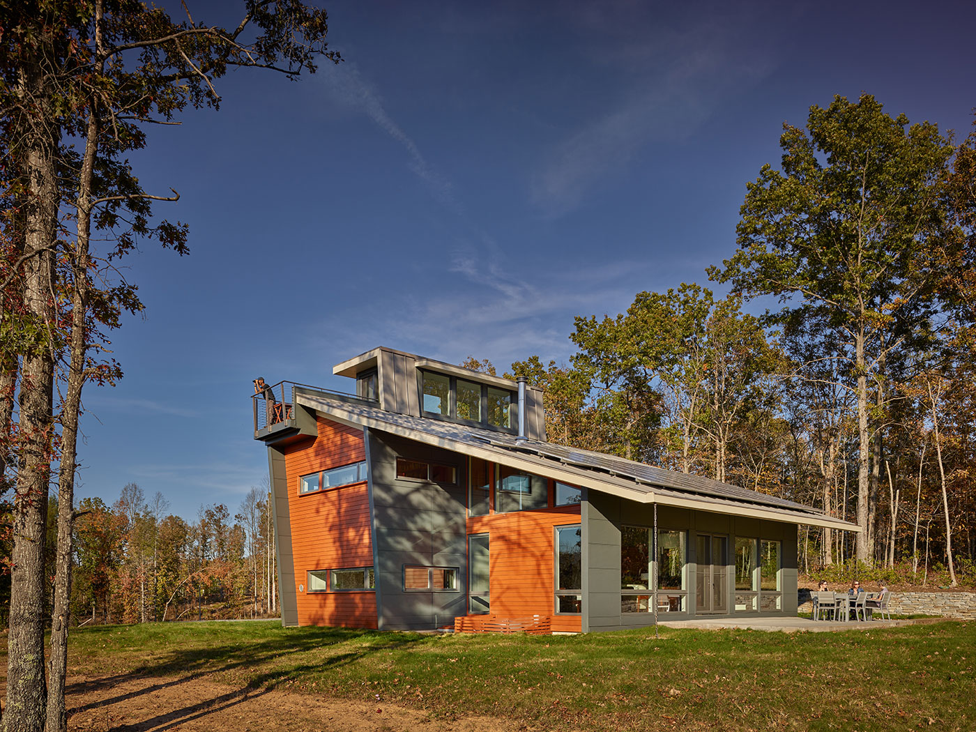 Charlottesville Net Zero Home With South-Facing Solar Panel Roof, Trapezoidal Windows, Wood, Hardipanel Siding and Carport by Virginia Residential Architect HEDS.