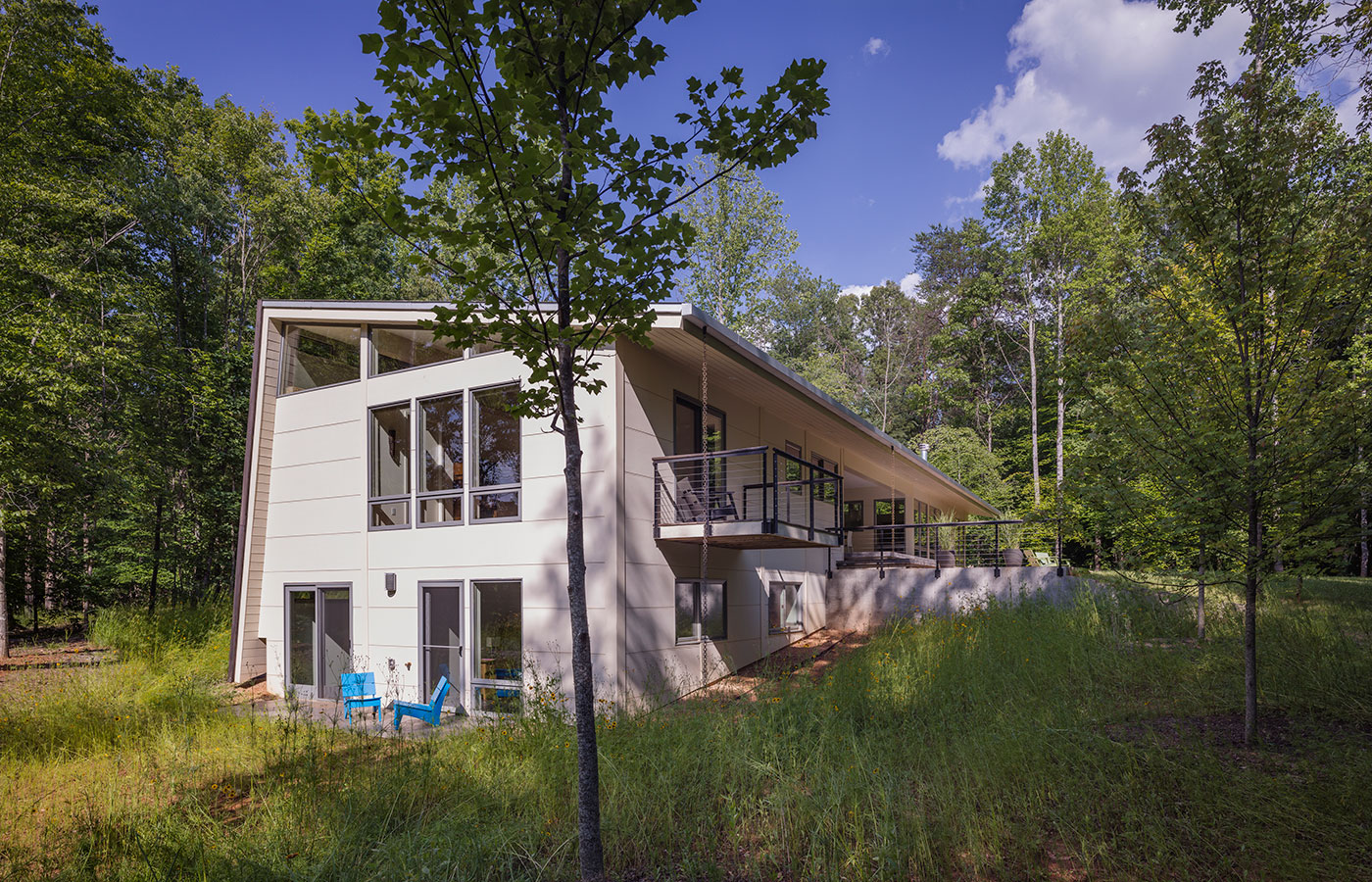 Richmond Road Modern Dogtrot House with Open Covered Porch Between Living Area and Bedrooms with White Hardipanel and Shou Sugi Ban Siding by Chris Hays, Charlottesville-based Architect of HEDS.