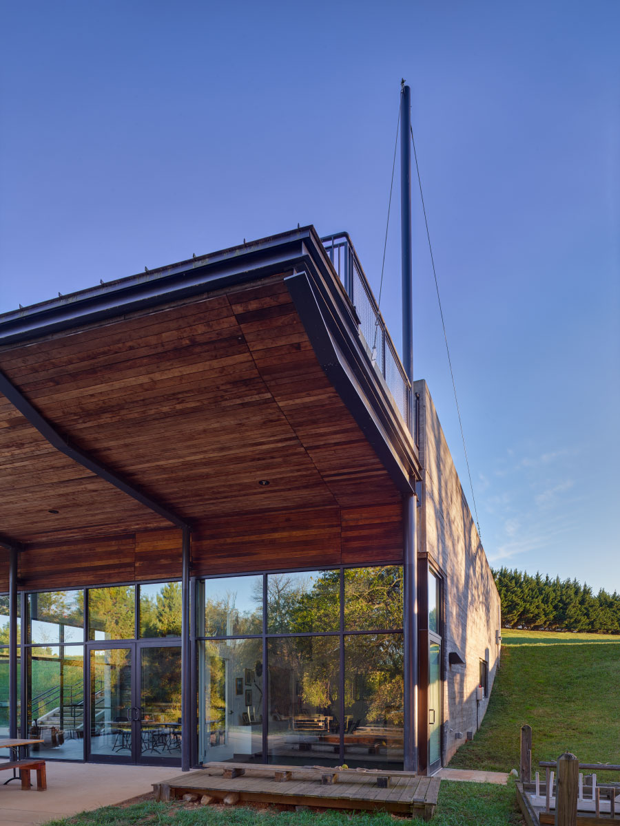Lewis & Clark Exploratory Center of Virginia Image Showing Wood Soffit Roof, Masts and Board-Formed Concrete Walls Designed by Modern and Green Charlottesville HEDS Architects.